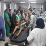 Israel-Hamas war casualty treated by doctors.