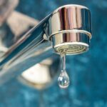 Water supply, A drop of water drips from a leaky faucet.