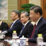 This handout photo taken and released by the European Council Press Service on December 7, 2023 shows China's President Xi Jinping (R) and China's Foreign Minister Wang Yi (2nd R) attending the 24th EU–China Summit in Beijing.