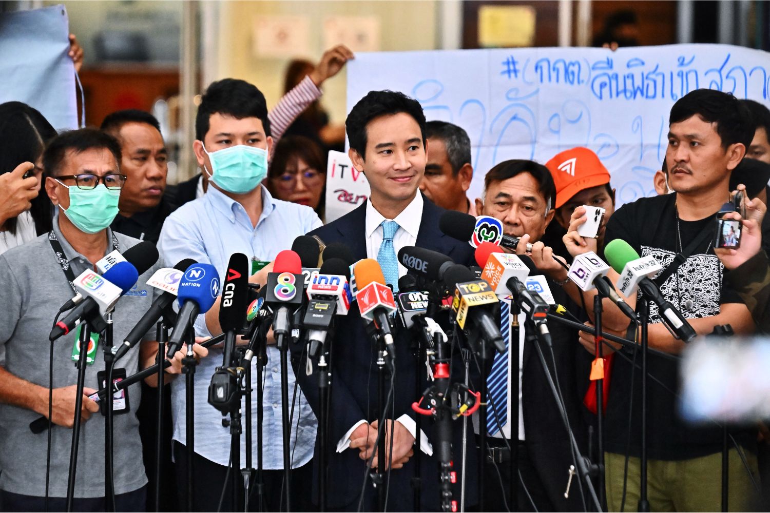 Former Thai prime ministerial candidate and ex-Move Forward Party leader Pita Limjaroenrat speaks to media as he leaves a hearing regarding his ownership of media shares at the Constitutional Court in Bangkok on December 20, 2023. (Photo by Lillian SUWANRUMPHA / AFP)