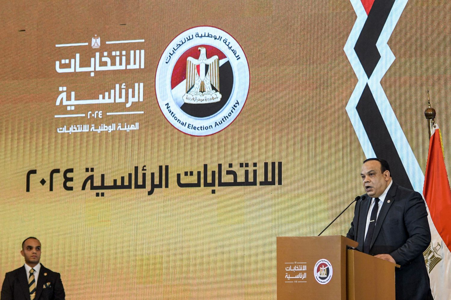 Hazem Badawy, head of Egypt's National Elections Authority, announces the results of the 2024 Egyptian presidential elections in Cairo on December 18, 2023. Egypt's President Abdel Fattah al-Sisi has won a new six-year term with 89.6 percent of the vote, the election authority announced on December 18. Turnout reached an "unprecedented" 66.8 percent of Egypt's 67 million voters, said its chief, Hazem Badawy. Over 39 million voted for Sisi, a former army chief who has ruled the most populous Arab country for a decade. (Photo by Ahmed HASAN / AFP)