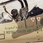 A pilot of the Royal Saudi Air Force waves to ground personnel to take off in his American made F-15 Eagle Fighter Jet on Wednesday, August 15, 1990 at an Air Base in Saudi Arabia. The Saudi Air Force is being augmented by American Air Power as they prepare to defend against the Iraqi military threat. (AP Photo/Scott Applewhite)