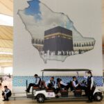 Drivers rest as they wait for the coming pilgrims flight at the Hajj terminal of King Abdulaziz International Airport in Jeddah, Saudi Arabia, Tuesday, June 20, 2023. Hundreds of thousands of Muslims have arrived in the kingdom to participate in the annual Hajj pilgrimage, a ritual required of all able-bodied Muslims at least once in their life. (AP Photo/Amr Nabil)