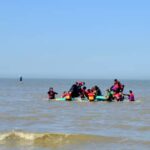 Migrants aboard inflatable boats as they cross the English Channel.