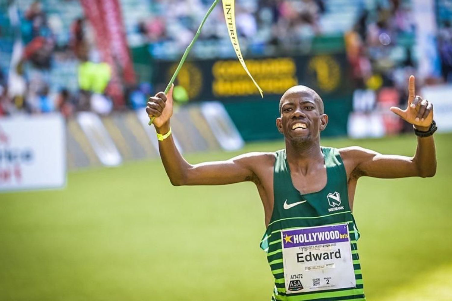 Comrades marathon champion Edward Mothibi waving a flag