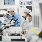 Employees work at Flextronics International Ltd's China unit in Suzhou, Jiangsu province.